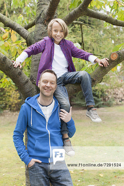 Germany  Leipzig  Father and son having fun  smiling  portrait