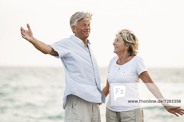 Spain  Senior couple having fun at the sea