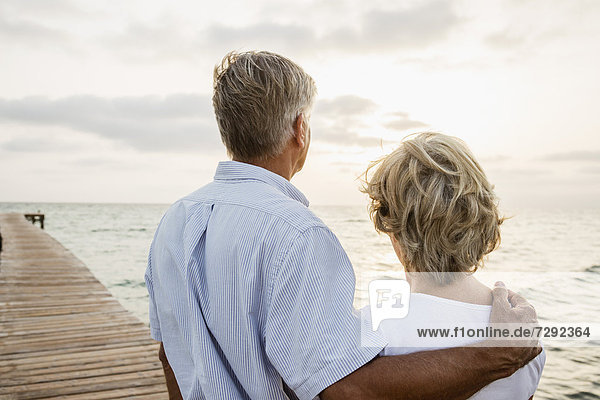 Spain,  Senior couple standing at the sea
