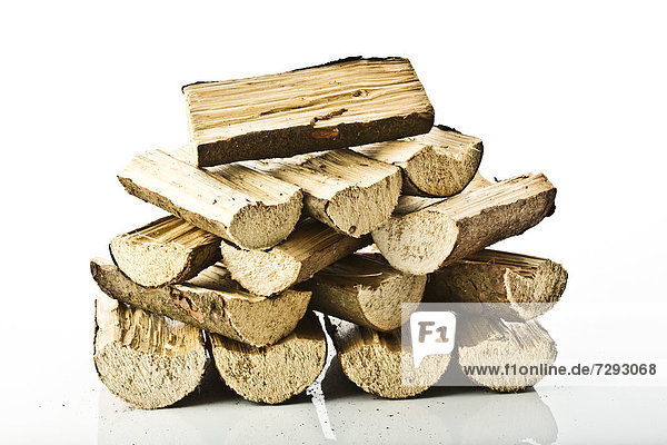 Close up of firewood on white background