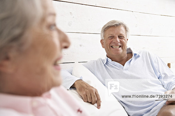 Spain  Senior couple relaxing in hotel  smiling