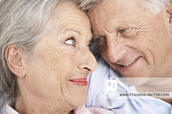 Spain  Senior couple looking at each other  smiling