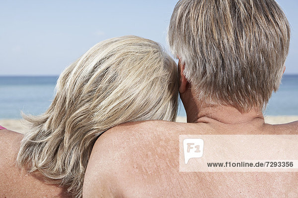 Spain,  Mallorca,  Senior couple sitting at beach