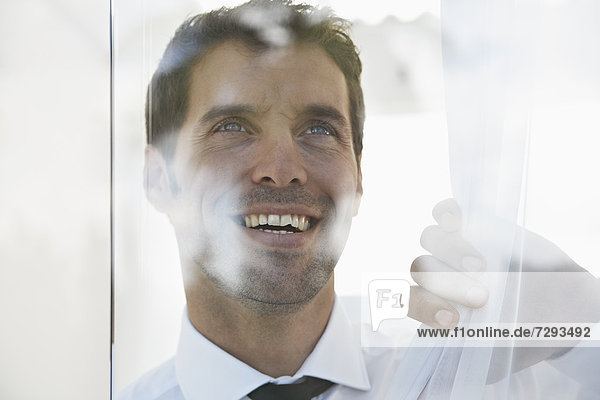 Spain  Businessman thinking  smiling