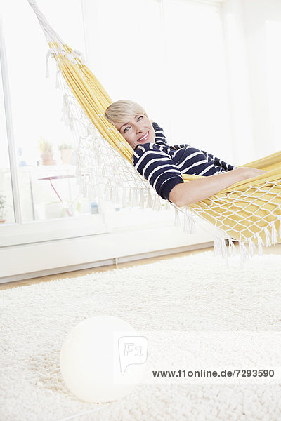 Woman relaxing in hammock  portrait