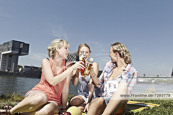 Young women drinking beer