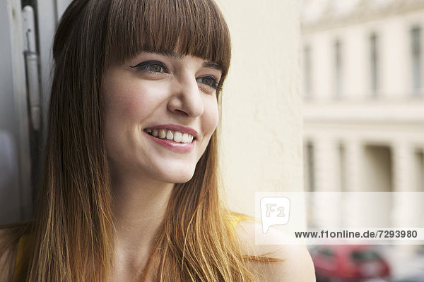 Young woman looking away  smiling