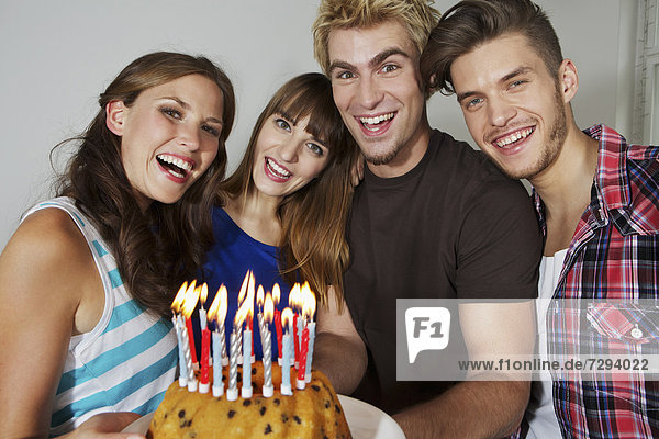 Germany,  Berlin,  Group of young people celebrating birthday