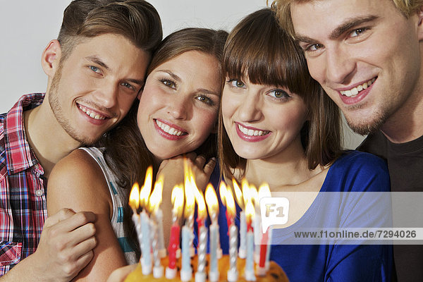 Germany,  Berlin,  Group of young people celebrating birthday