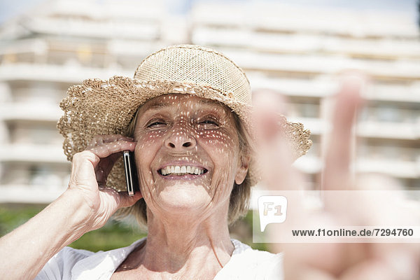 Spain  Senior woman talking on mobile phone