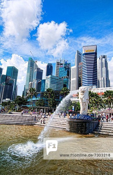 Singapore downtown famous Lion symbol Merlion and skyline of city in Fullerton Area of Clarke Quay area