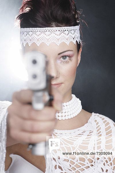 Gun-wielding moll