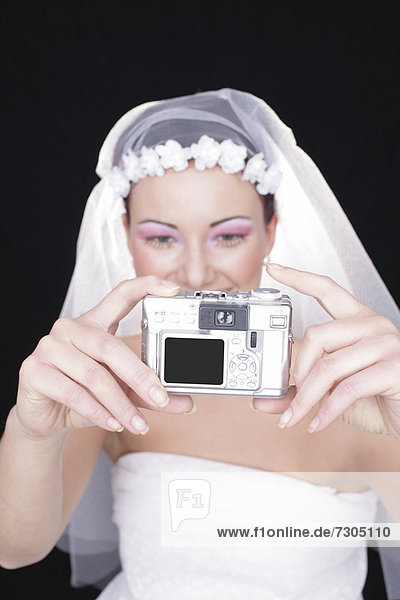 Braut fotografiert sich selbst