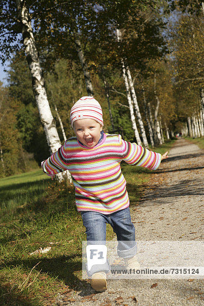 Three-year-old girl running