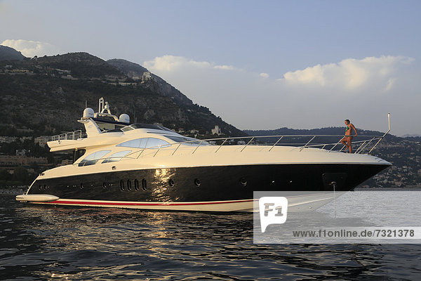 Leonardo II  a cruiser built by Azimut  type of boat: Leonardo 98  length: 30.15 m  built in 2004  a young woman sitting on the bow  French Riviera  France  Mediterranean Sea  Europe