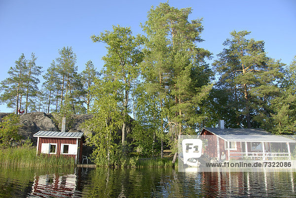 Summer house with a sauna cabin on an island in Lake Saimaa near Savonlinna  Finland  Europe