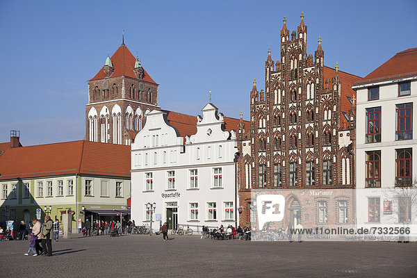 East side of the market square with St. Mary's Church and the Marimar CafÈ  building with a historic brick gable  Greifswald  Mecklenburg-Western Pomerania  Germany  Europe