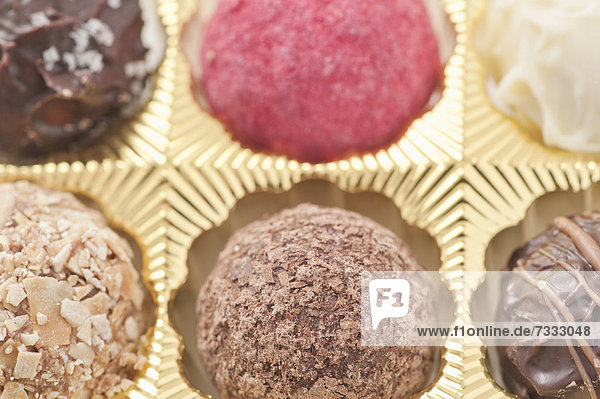 Closeup of chocolate truffles in a box of chocolates