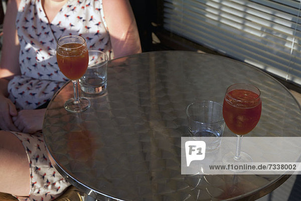 Two drinks on metal table