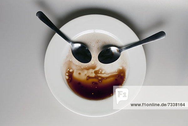 Abstract face made from spoons  plate and balsamic vinegar
