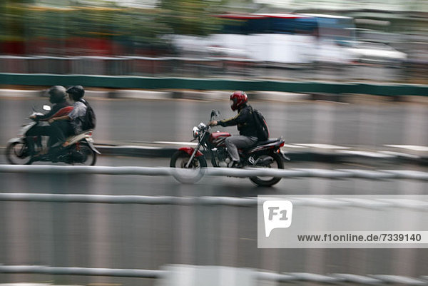 Three motorcycle rides on the streets of Jakarta  Indonesia