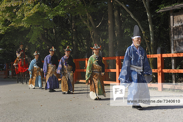 Final procession of Shinto helpers at the riders competitions at the traditional Kamigamo Shrine  UNESCO World Heritage Site  Kyoto  Japan  East Asia