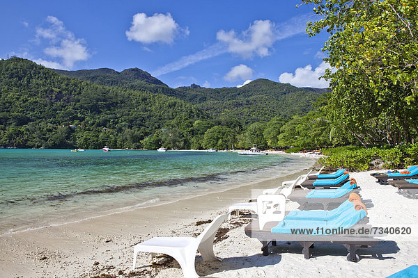 Sunloungers on the beach of the Ephelia Resort at Port Launay Marine National Park  Mahe Island  Seychelles  Africa  Indian Ocean
