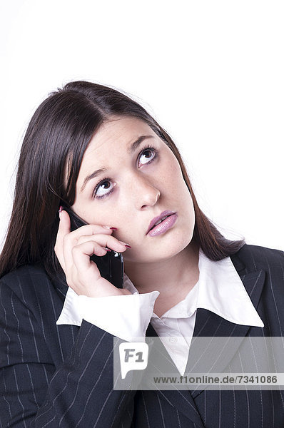 Geschäftsfrau beim Telefonieren  genervt