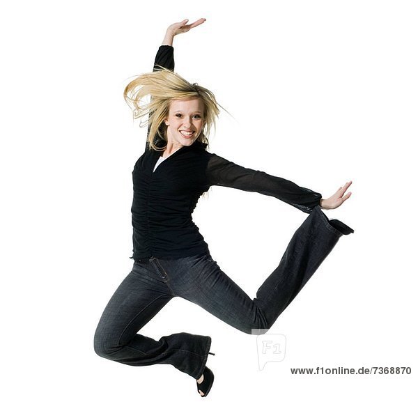 Woman jumping and smiling