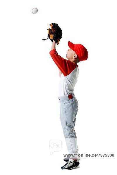 Profile of a baseball player standing in a catching position