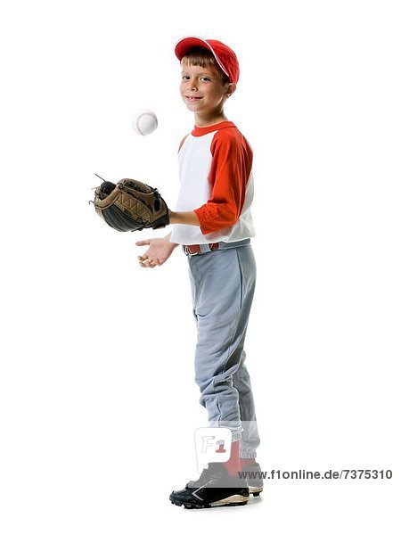 Portrait of a baseball player tossing a baseball