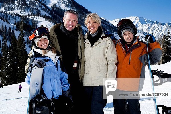 A family on a snowy mountain