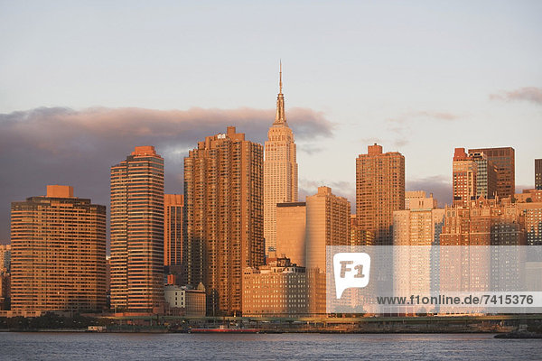 Skyline with Empire State Building at sunset