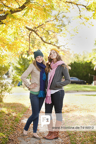 Portrait of two young women in autumn day