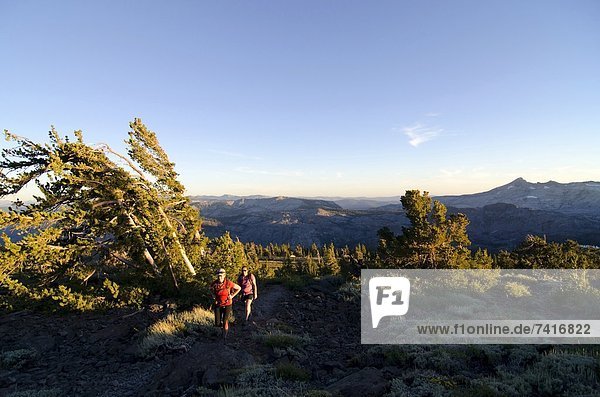 Two women hike near the summit of Mount Tallac in Lake Tahoe  CA.