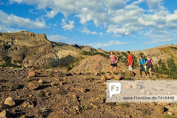 A family enjoys the views and exhilaration on a Summer hiking adventure.
