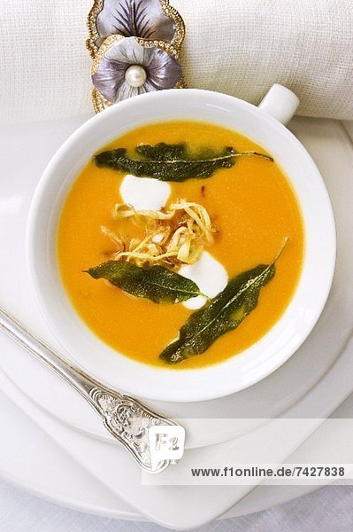Pumpkin and ginger soup with fried sage leaves