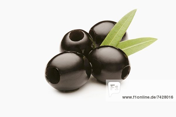 Large Black Olives on a White Background
