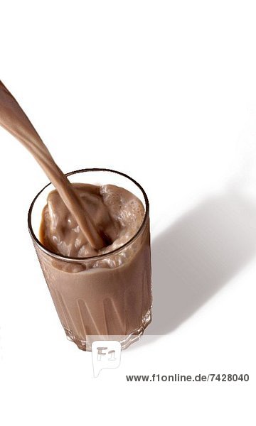 'Chocolate Milk Pouring into a Glass