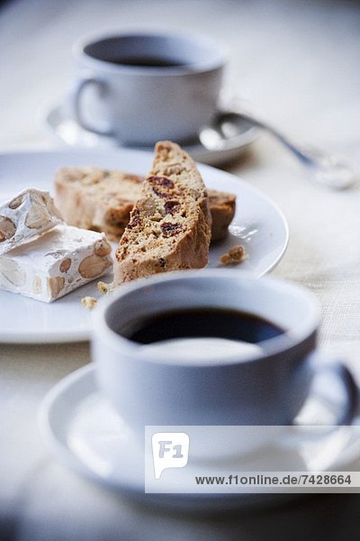 Cups of Espresso with Biscotti and Almond Nougat