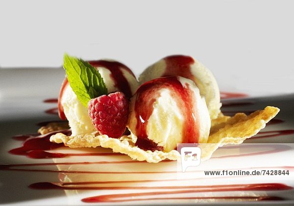 Lime ice cream with raspberry sauce and vodka