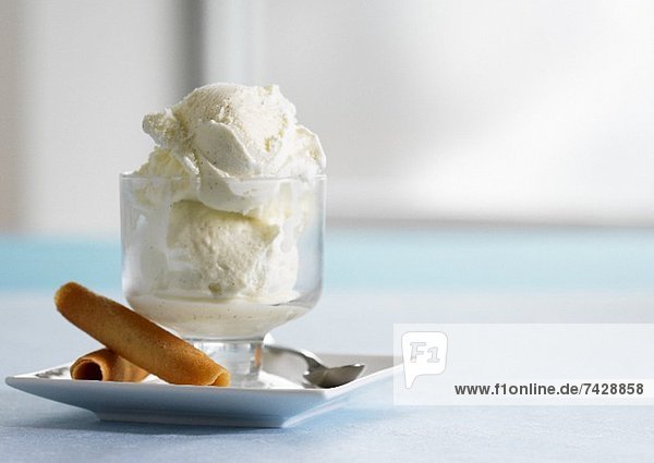 Vanilla ice cream with wafer rolls