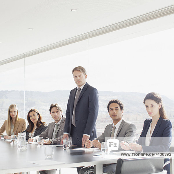Portrait of confident business people in conference room