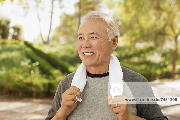 Smiling older man resting after workout