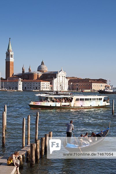 Quay at St. Mark's Square with gondolas  San Giorgio Maggiore Island  Venice  UNESCO World Heritage Site  Veneto  Italy  Europe