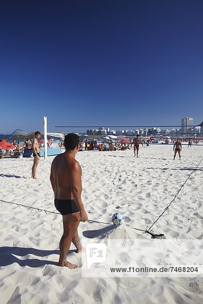 Men playing foot volley (futevolei) on Copacabana beach  Rio de Janeiro  Brazil  South America