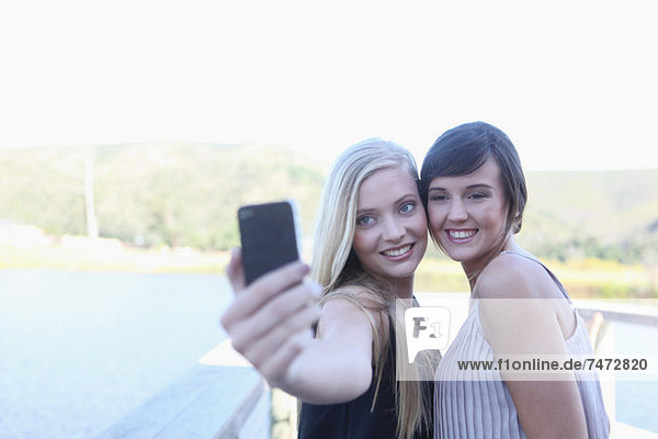 Women taking picture of themselves