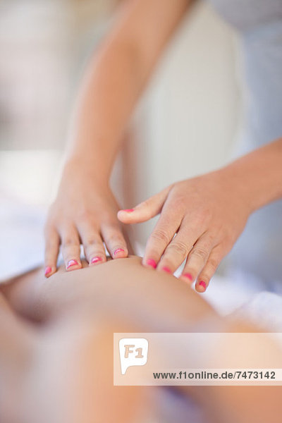 Woman having leg massage