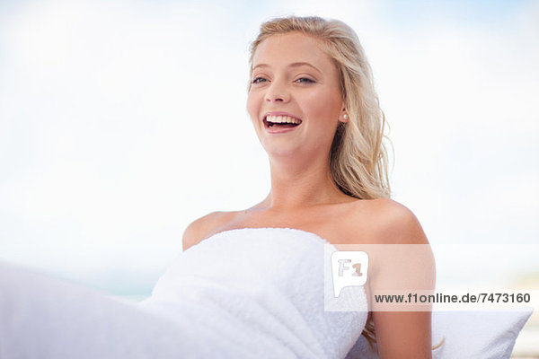 Smiling woman relaxing outdoors