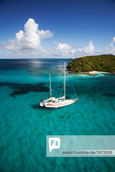 Sailboat in tropical water
